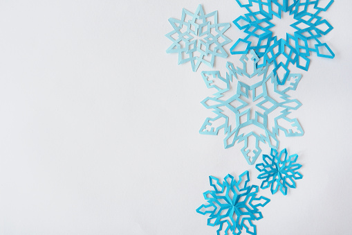 snowflakes from paper. Preparation from a clean sheet of paper and snowflakes.