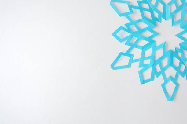 istock snowflakes from paper on a white background 866179398