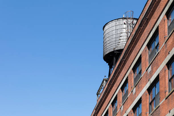 istock Water tank on roof in New York 866181276