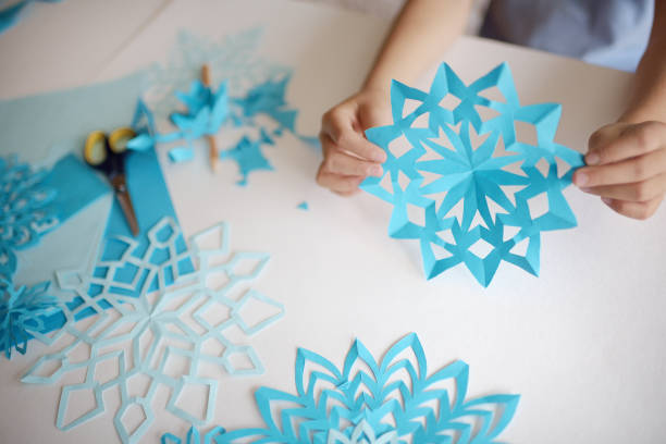 istock Making of snowflakes from paper. 866181898