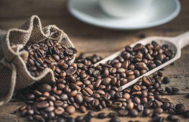 istock Coffee Beans Spilled out of Burlap Sack 866182184
