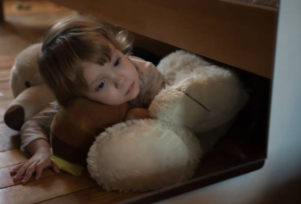 istock Sad Little Girl Holding Her Teddy Bear 866183470
