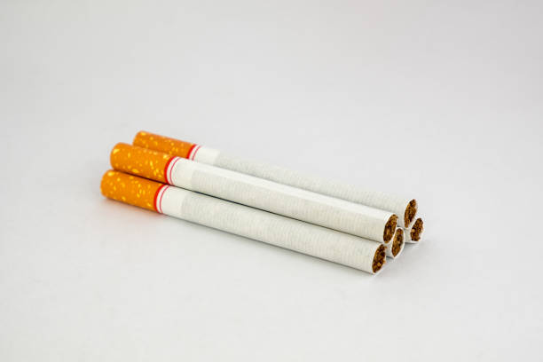 istock Tobacco cigarettes pile on white background 866187260