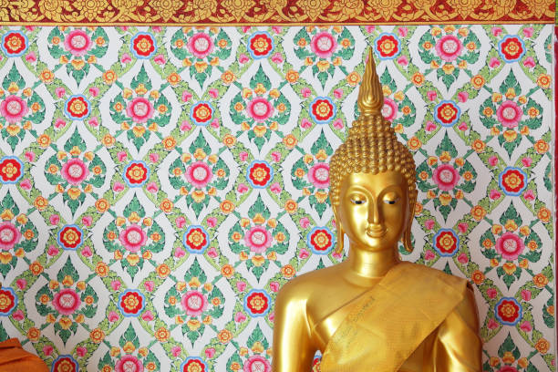 istock golden buddha statue with tradition wallpaper background. 866187324