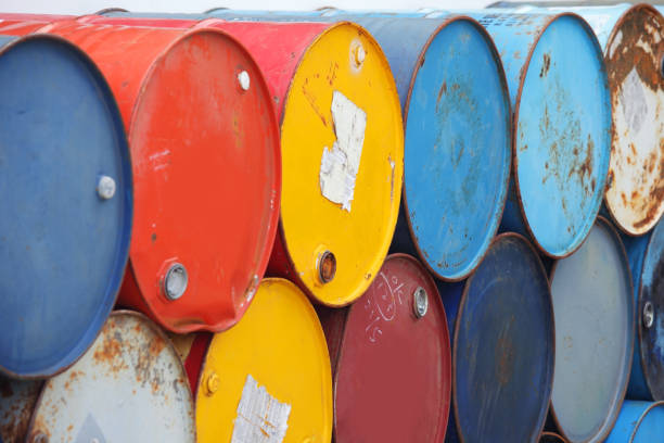 istock stack of grunge industrial barrels background. 866188212