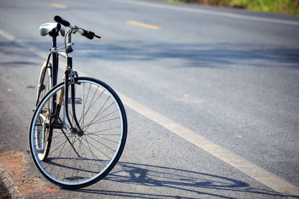 istock vintage bicycle beside the road 866190736