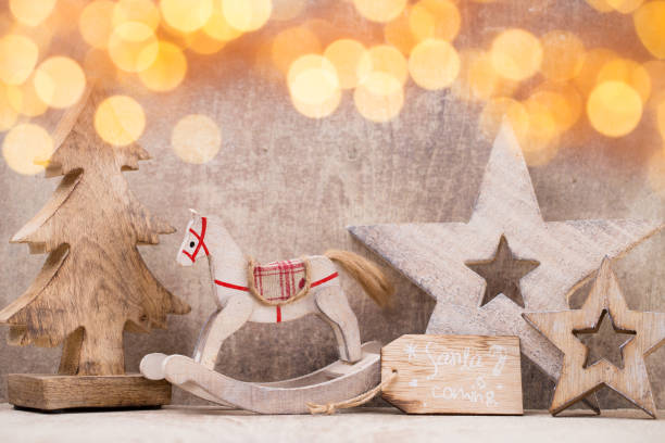 istock Christmas tree decorations on a wooden background. With bokeh ornaments. 866191266