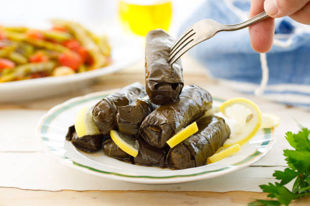 dolma dish on a table served by the chef - olive green olive stuffed food imagens e fotografias de stock