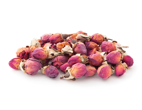Heap of rose buds for herbal tea isolated on white background
