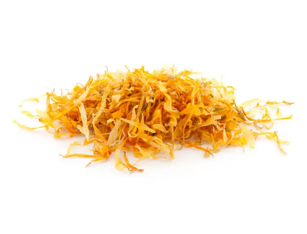 Heap of calendula petals for herbal tea isolated on white background