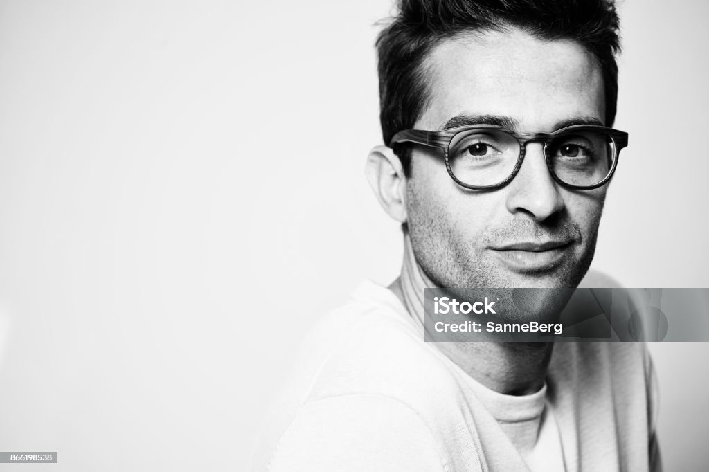 Glasses guy Good looking glasses guy in studio Black And White Stock Photo