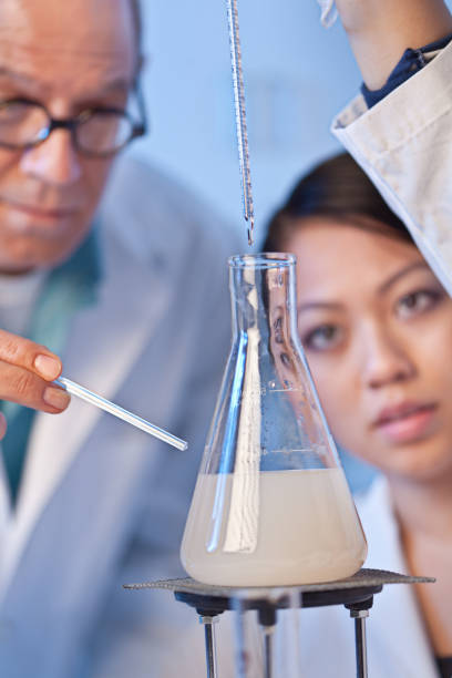 istock Two Scientists Chemist Working Together in a Laboratory in a Chemical Solution 866201354