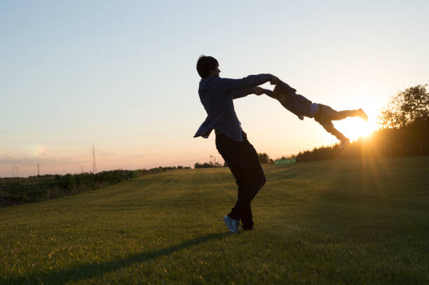 istock Father and baby boy having fun at the field 866201436