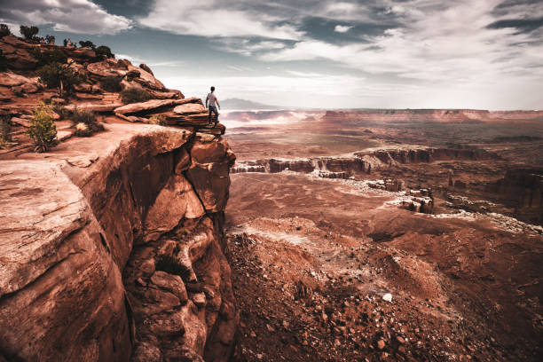 istock man on top of canyonlands 866210568