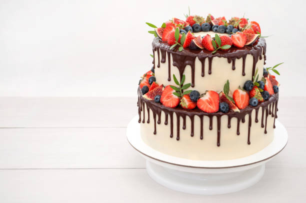 istock Cake in chocolate, decorated with berries. 866213476