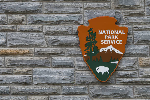 National Park Service Sign With Copy Space to Left Cherokee, United States: April 16, 2017: National Park Service Sign With Copy Space to Left latch photos stock pictures, royalty-free photos & images