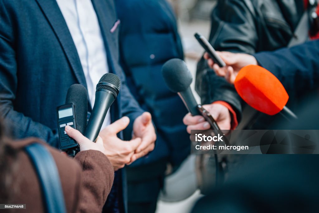 Interviewing businessman or politician, press conference Journalist Stock Photo
