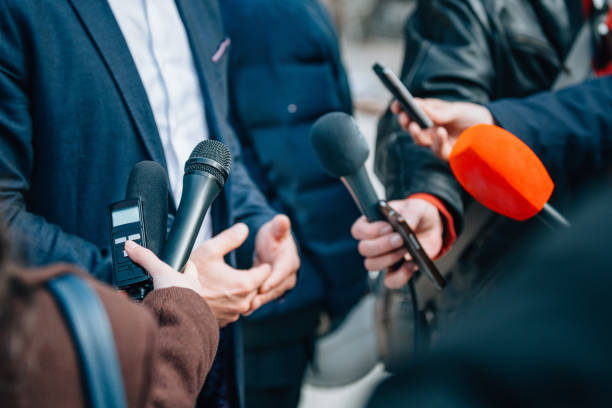 Interviewing businessman or politician, press conference Interviewing businessman or politician, press conference press room stock pictures, royalty-free photos & images
