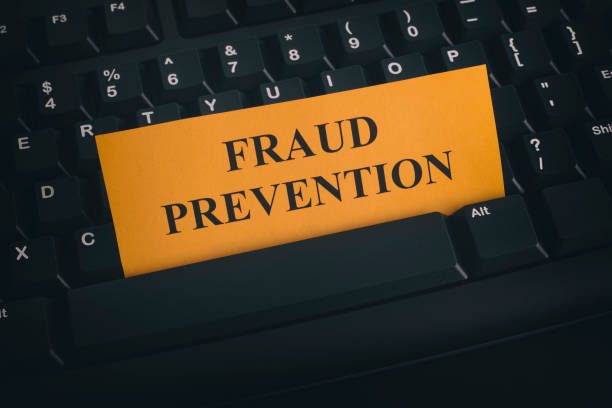 istock Yellow paper note on black keyboard with writing Fraud Prevention 866214800