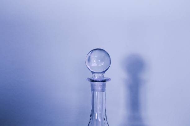 Corked glass bottle with Dreams note on white background