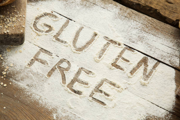 istock Bread on wooden table with scattered flour. 866215300