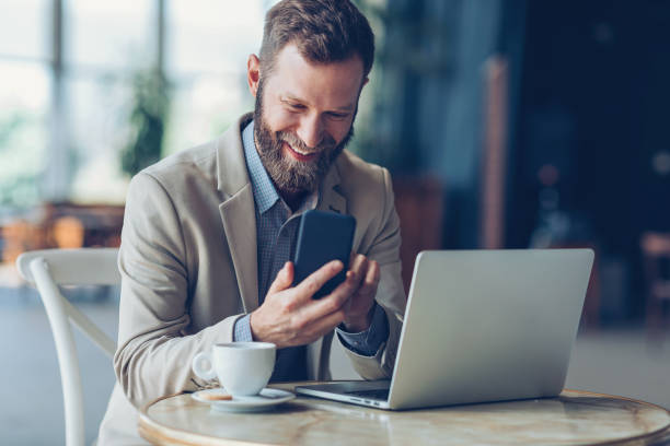 istock Businessman messaging in the coffee break 866215314