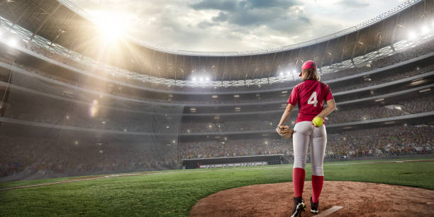 istock Softball female player on a professional arena 866218880