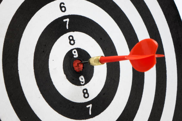 istock Target with arrow in the center on a white background 866219420
