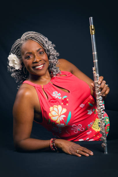 istock Pretty Smiling Woman Holding Her Flute 866232764