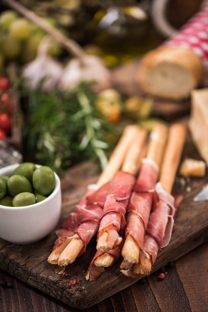 istock Bread sticks with prosciutto ham,italian tapa food 866236572