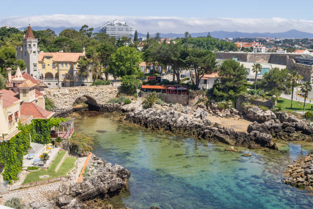 Historic buildings and rock bridge in Cascais, Portugal