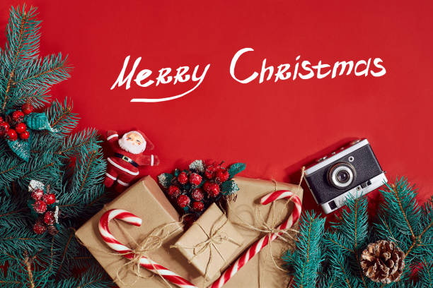 istock Fir branch and gift box on red background 866240186