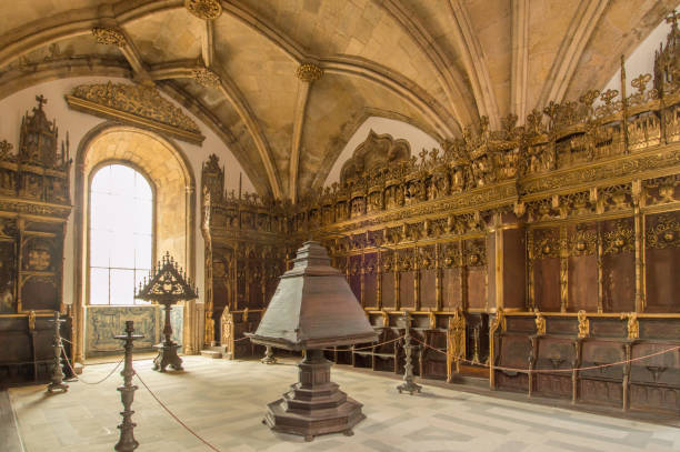 Choir in the Igreja de Santa Cruz, Coimbra, Portugal The choir of the Santa Cruz church in Coimbra, Portugal. The Santa Cruz monastery is one of the most fascinating religious buildings of Coimbra. The ancient church is the final resting place of Portuguese kings, has numerous glaring design flaws and an organ that can only be played by four people. One of the most notable feature of the Santa Cruz church are the Azulejos tiles that line the walls of the church and depict key events in Portugal’s history. coimbra city stock pictures, royalty-free photos & images