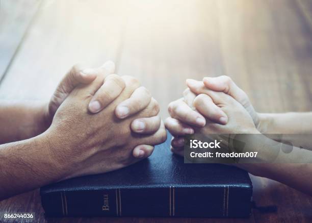 Husband And Wife Are Praying Together Stock Photo - Download Image Now - Praying, Couple - Relationship, Christianity