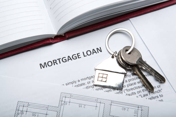 istock apartment keys with house key chain and a mortgage loan document and a diary 866244810