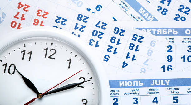 istock clock with wall calendar sheets with the number of days close up 866244864