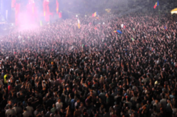 istock Blurred crowd of people partying 866247922
