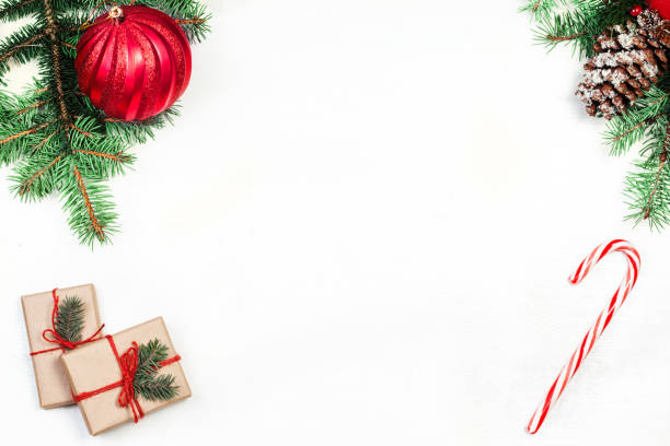 istock Christmas composition with fir tree branches, decorations  and striped candy cane red and white color. Wallpaper  for greeting card 866250596