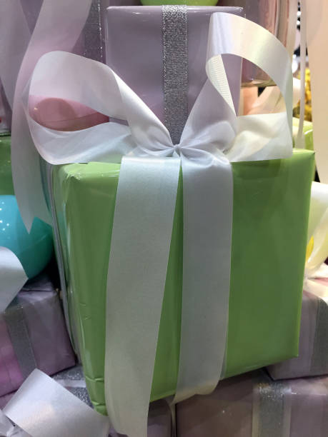 istock Christmas gift, Soft green gift box with white ribbons. 866251406