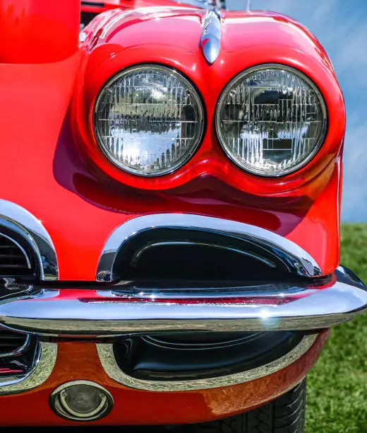 Vintage Red Sports Car front view, headlights and bumper detail