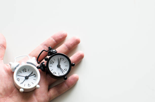 istock Alarm clock friends situation with hand 866254646