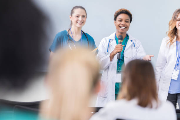 istock Diverse female doctors teach during medical conference 866255314