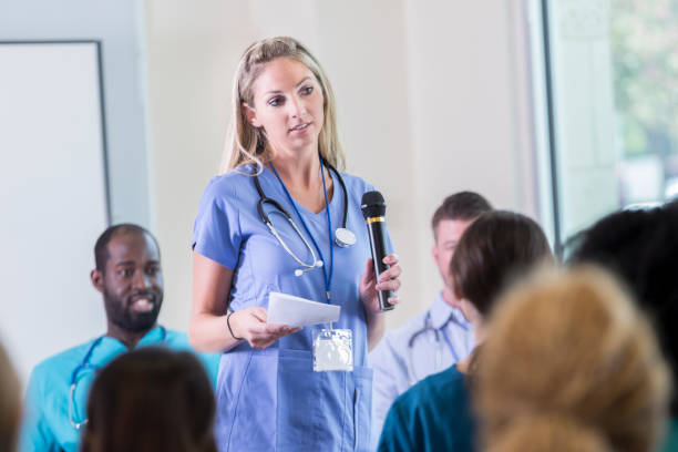 istock Serious nurse participates in health conference breakout session 866255354