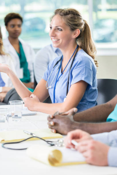 istock Experienced nurse participates in panel discussion during medical seminar 866255376
