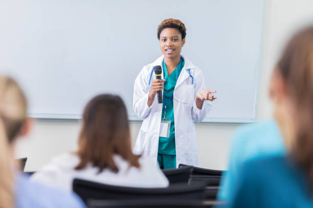 istock Young female physician teaches a class at a medical school 866255380