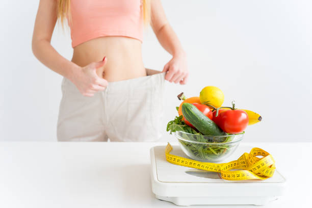 istock Woman losing weight 866260524