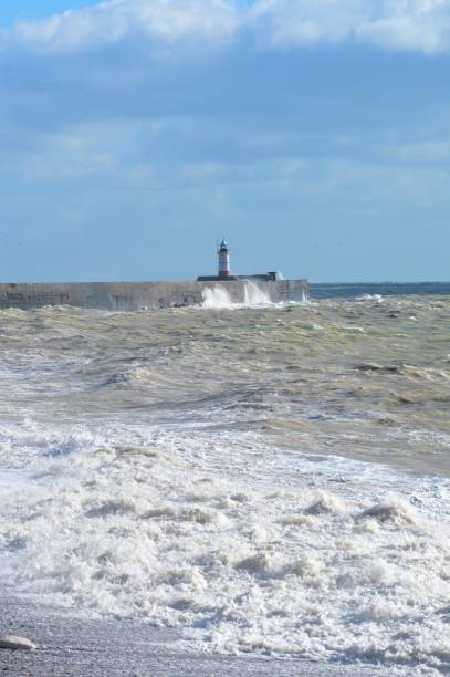 istock Harbour wall being pounded by heavy seas. 866264726