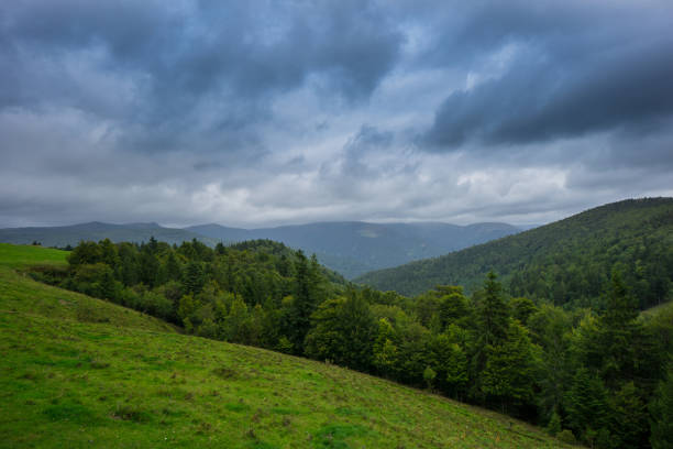 istock France - Dramatic sky cloud formations over french forest and mountains in alsace 866268932
