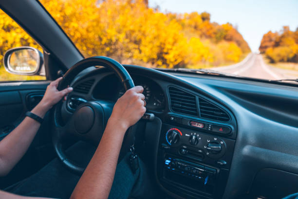 istock woman drive car on highway 866272586