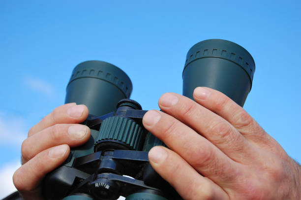 istock Binoculars in the hands of a man 866285074
